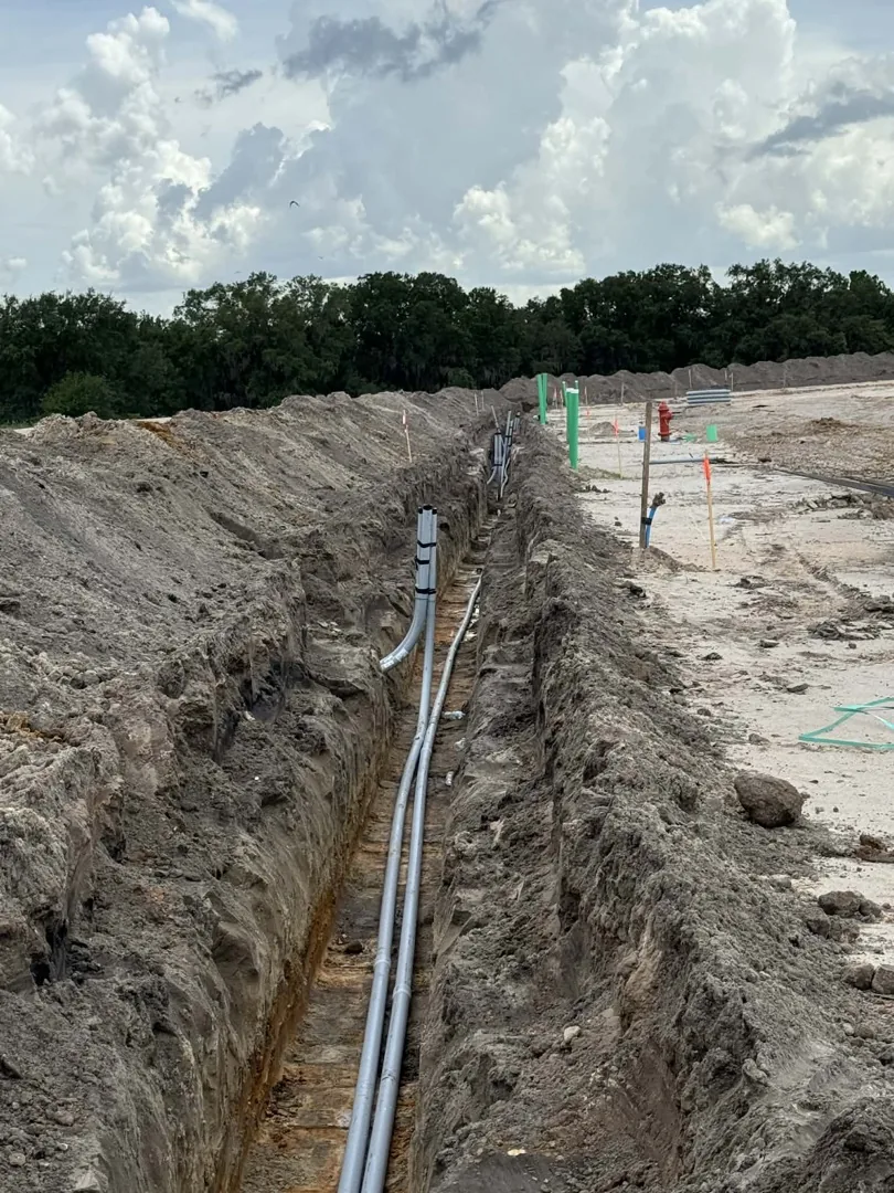 Straight trench with pipe installed along the bottom